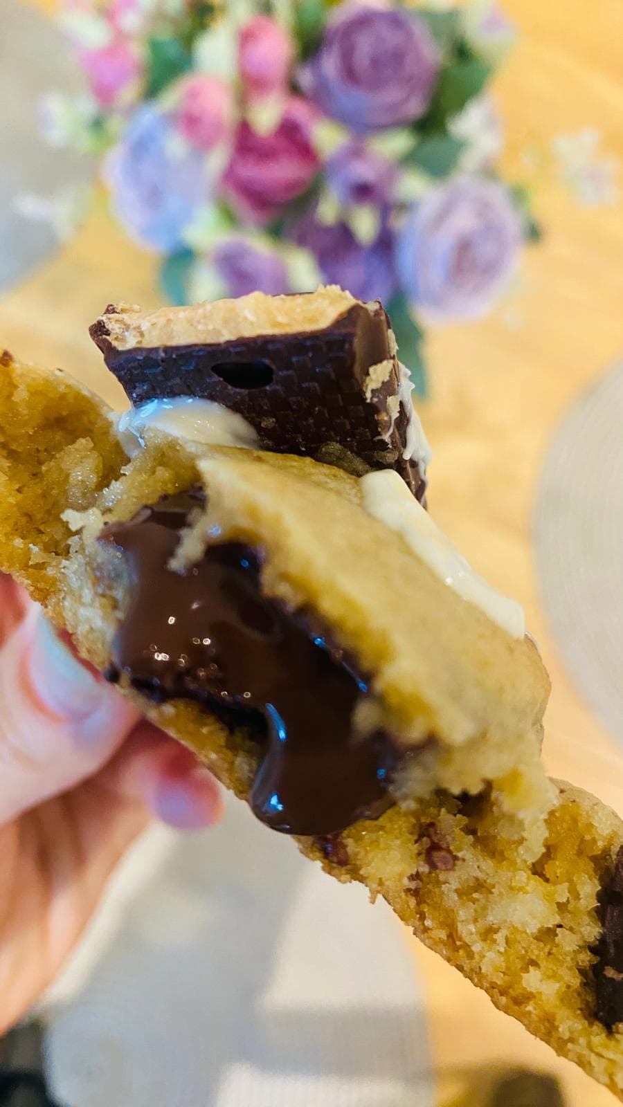 Kinder Bueno cookie split open with crème and wafer pieces