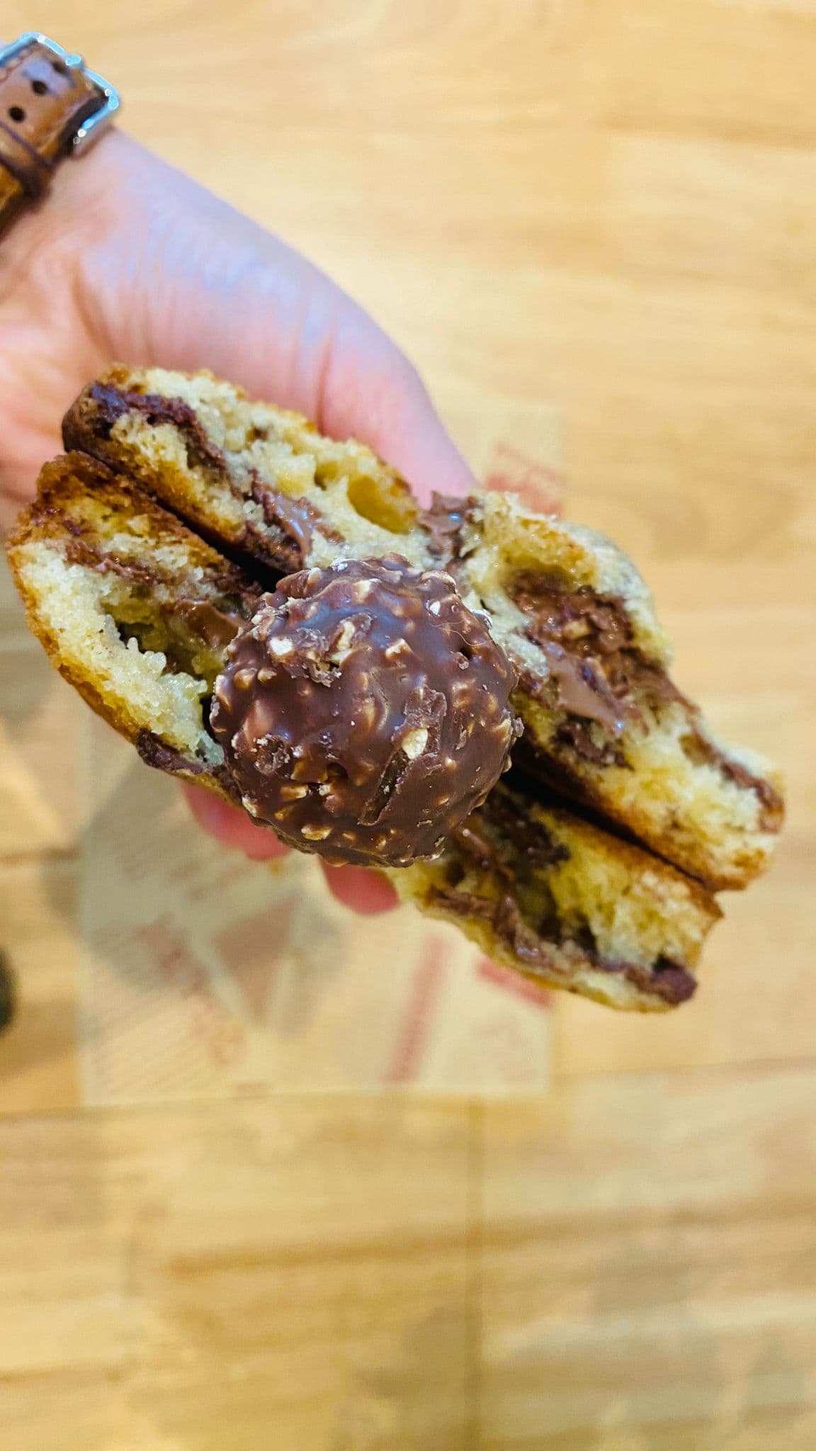 Ferrero Rocher cookie split open with hazelnut crème and chopped praline