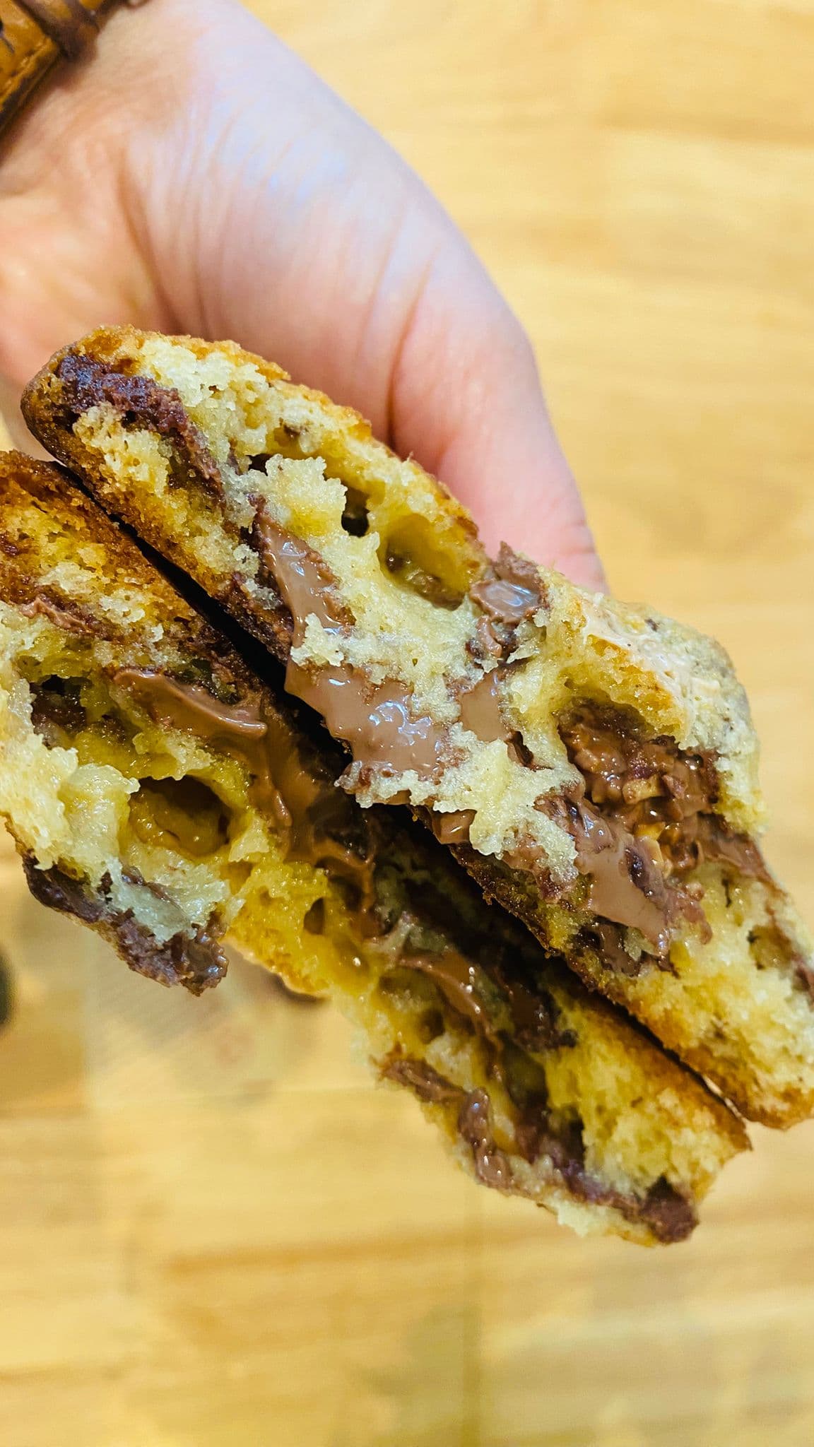 Ferrero Rocher cookie split open with hazelnut crème and chopped praline — alternate view